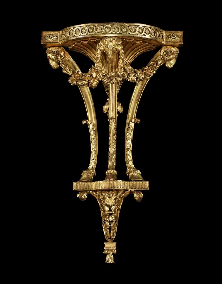 A giltwood bracket to a design by Robert Adam